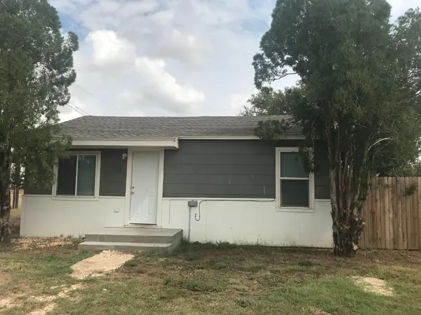 a kitchen with a sink cabinets and a window