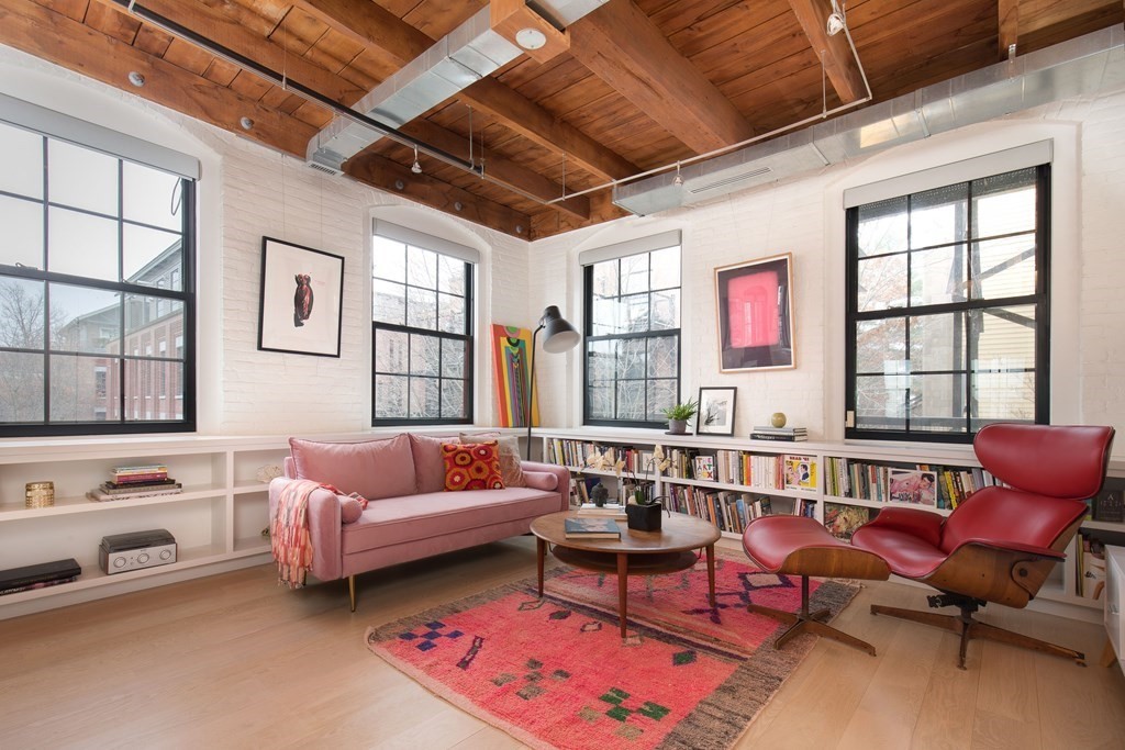 1 Tannery Brook Row, Unit 2A Somerville, MA 02144 - Photo 1 of 18 a living room with furniture a rug and a window