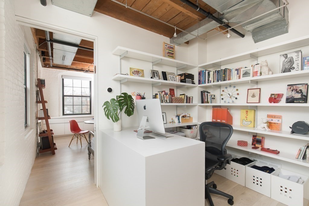 1 Tannery Brook Row, Unit 2A Somerville, MA 02144 - Photo 12 of 18 a work room with furniture and book shelf