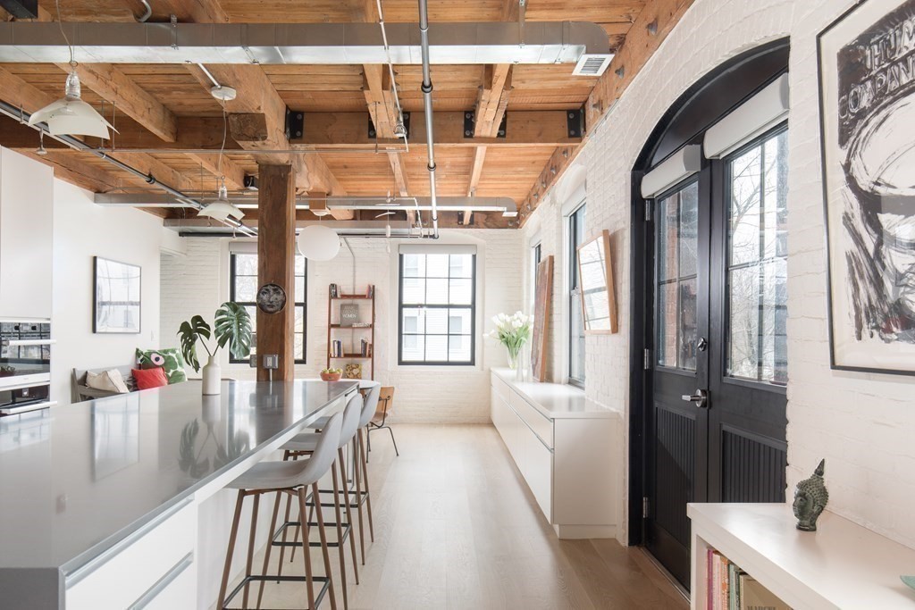 1 Tannery Brook Row, Unit 2A Somerville, MA 02144 - Photo 9 of 18 a view of a living room with furniture