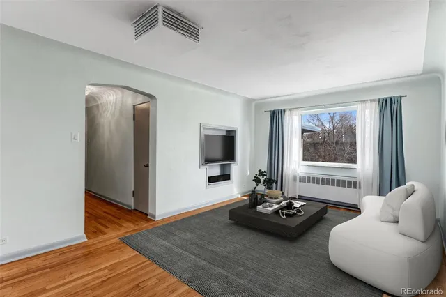 a living room with furniture and window