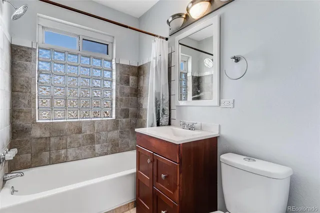 a bathroom with a sink a toilet and a bathtub