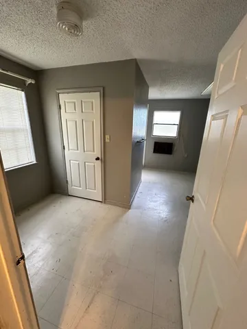 a view of empty room with windows