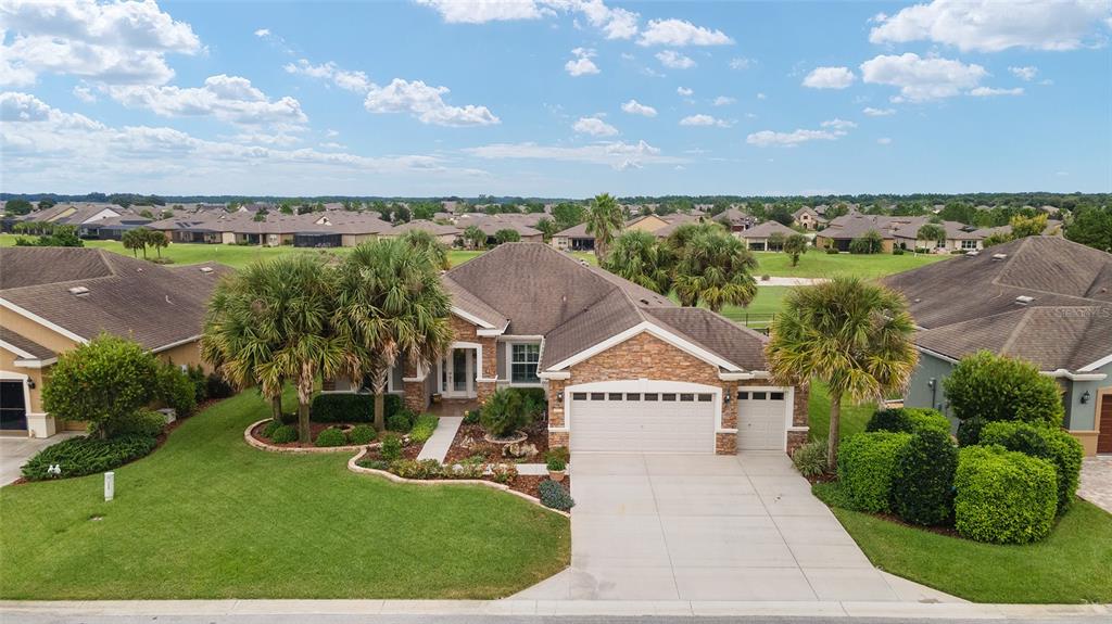 6937 Southwest 97th Terrace Road Ocala, FL 34481 - Photo 1 of 1 a view of a house with a yard and potted plants