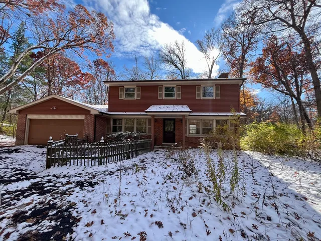 a front view of a house with yard