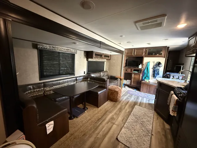 a living room with furniture flat screen tv and a fireplace