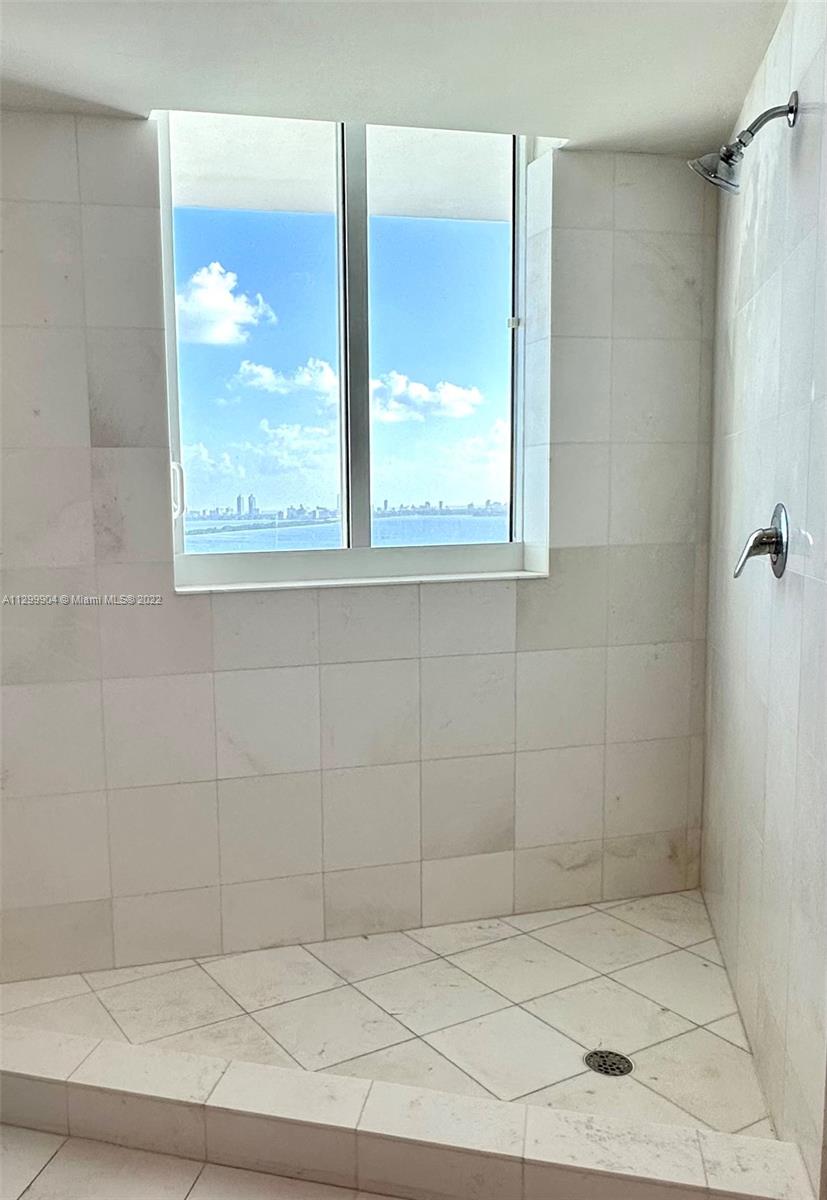 665 Northeast 25th Street, Unit 2104 Miami, FL 33137 - Photo 11 of 38 a bathroom with a shower