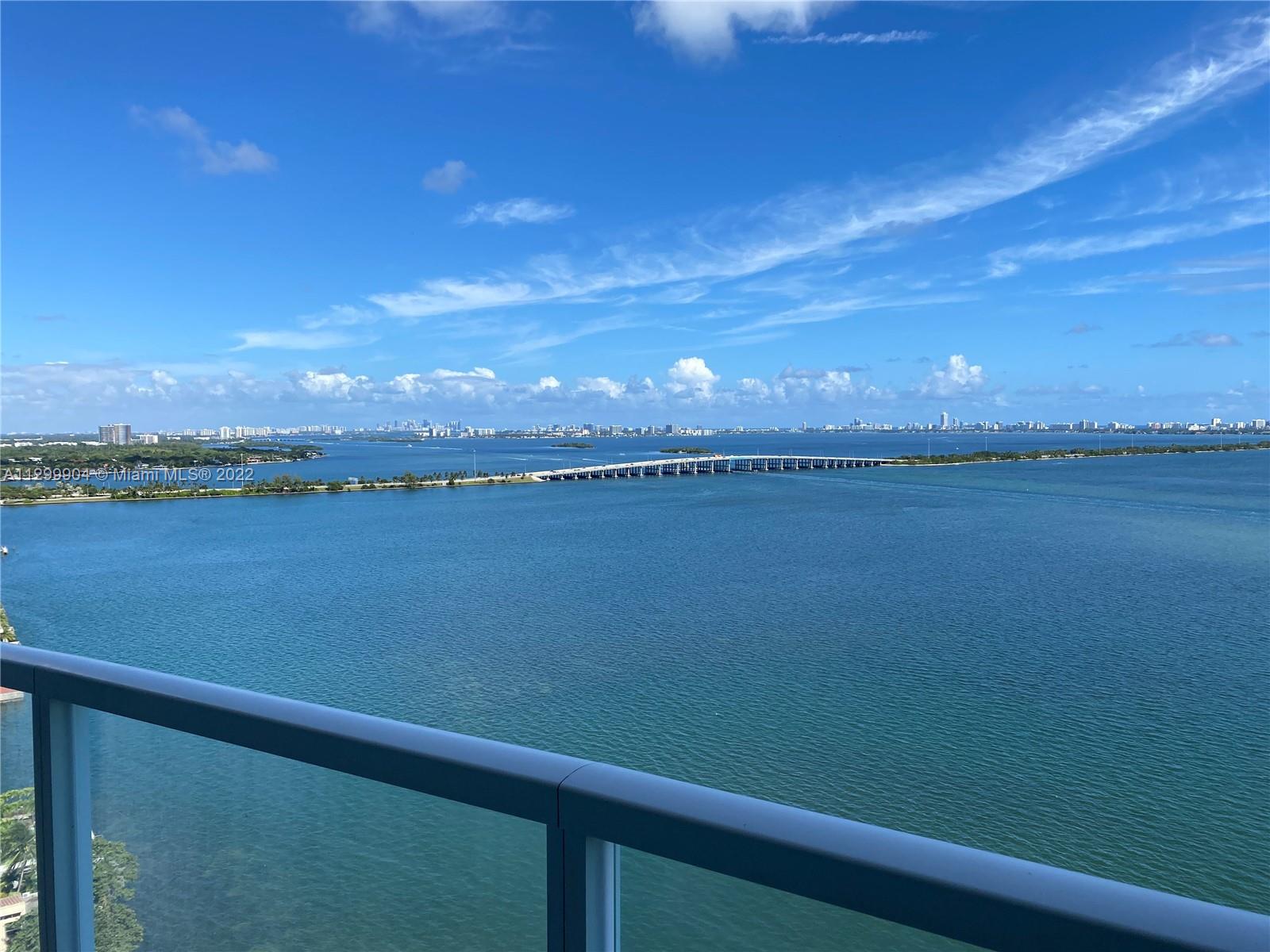 665 Northeast 25th Street, Unit 2104 Miami, FL 33137 - Photo 14 of 38 a view of a lake from a balcony