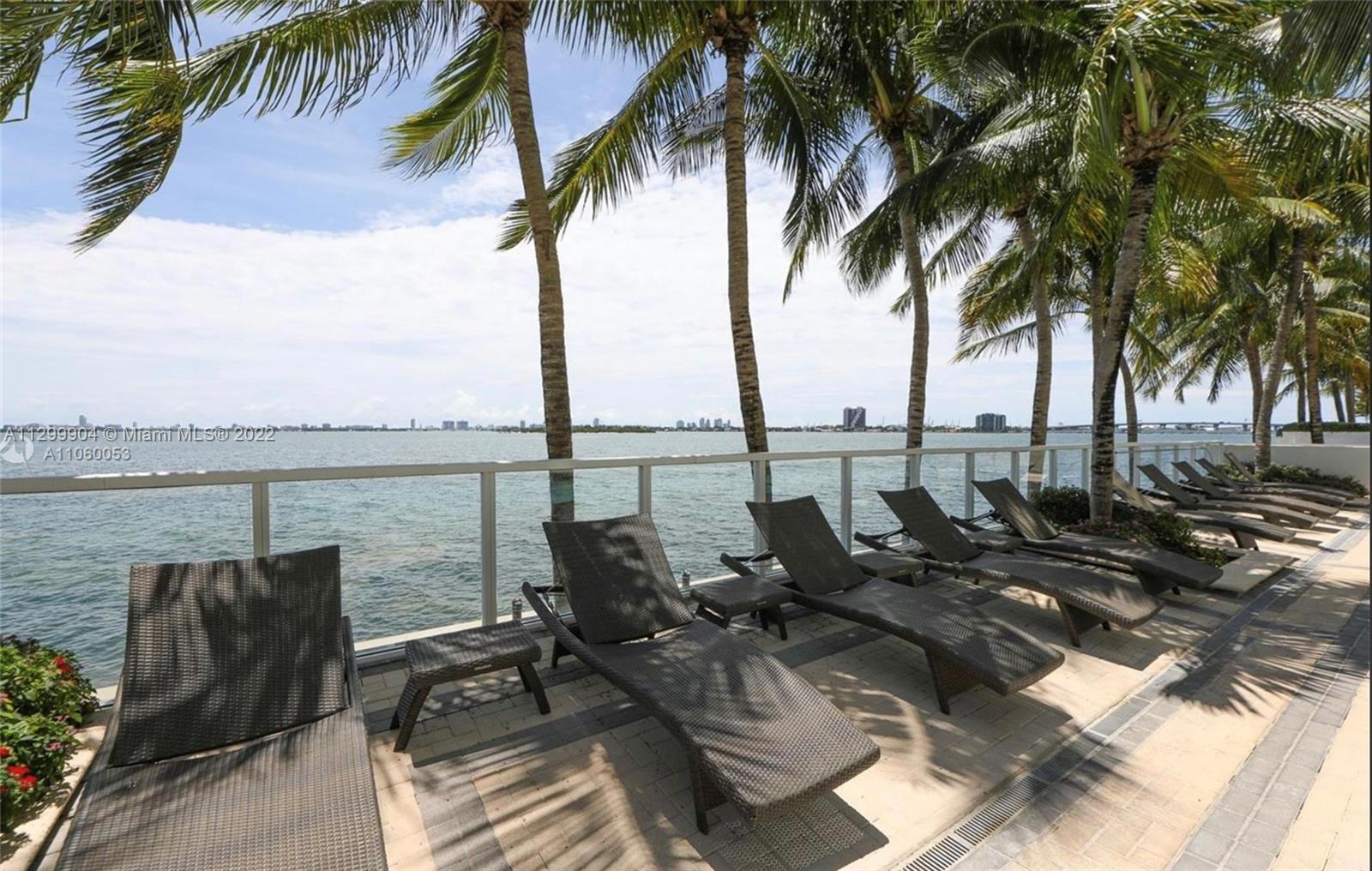 665 Northeast 25th Street, Unit 2104 Miami, FL 33137 - Photo 23 of 38 an ocean view with palm trees