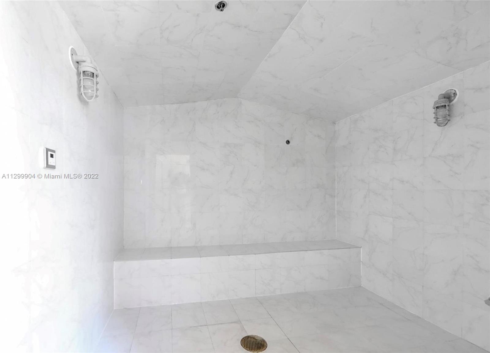 665 Northeast 25th Street, Unit 2104 Miami, FL 33137 - Photo 29 of 38 a bathroom with a bathtub