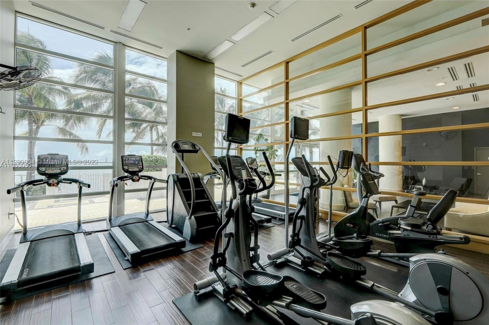 665 Northeast 25th Street, Unit 2104 Miami, FL 33137 - Photo 31 of 38 a view of a room with gym equipment
