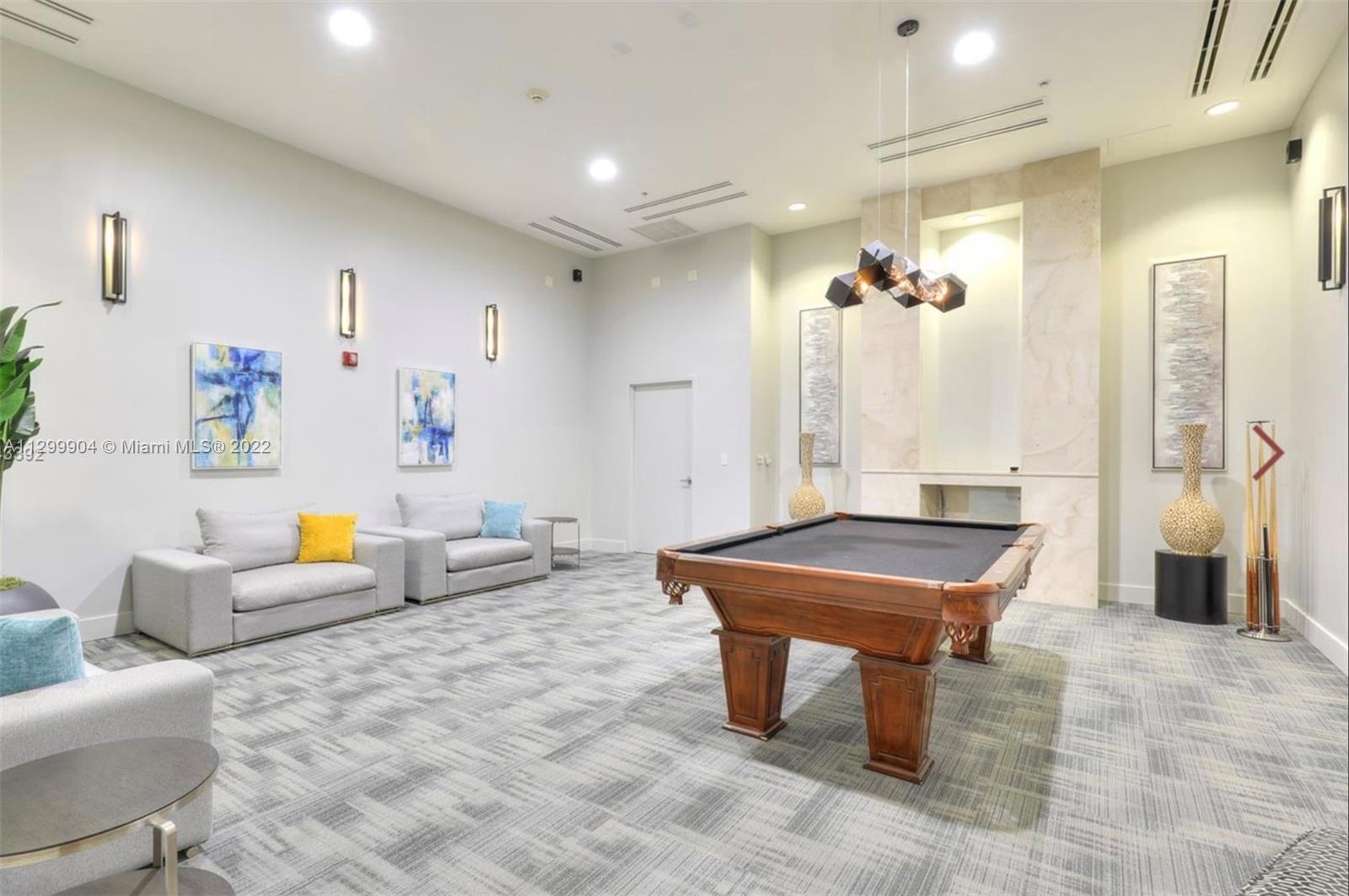 665 Northeast 25th Street, Unit 2104 Miami, FL 33137 - Photo 34 of 38 a living room with furniture and wooden floor