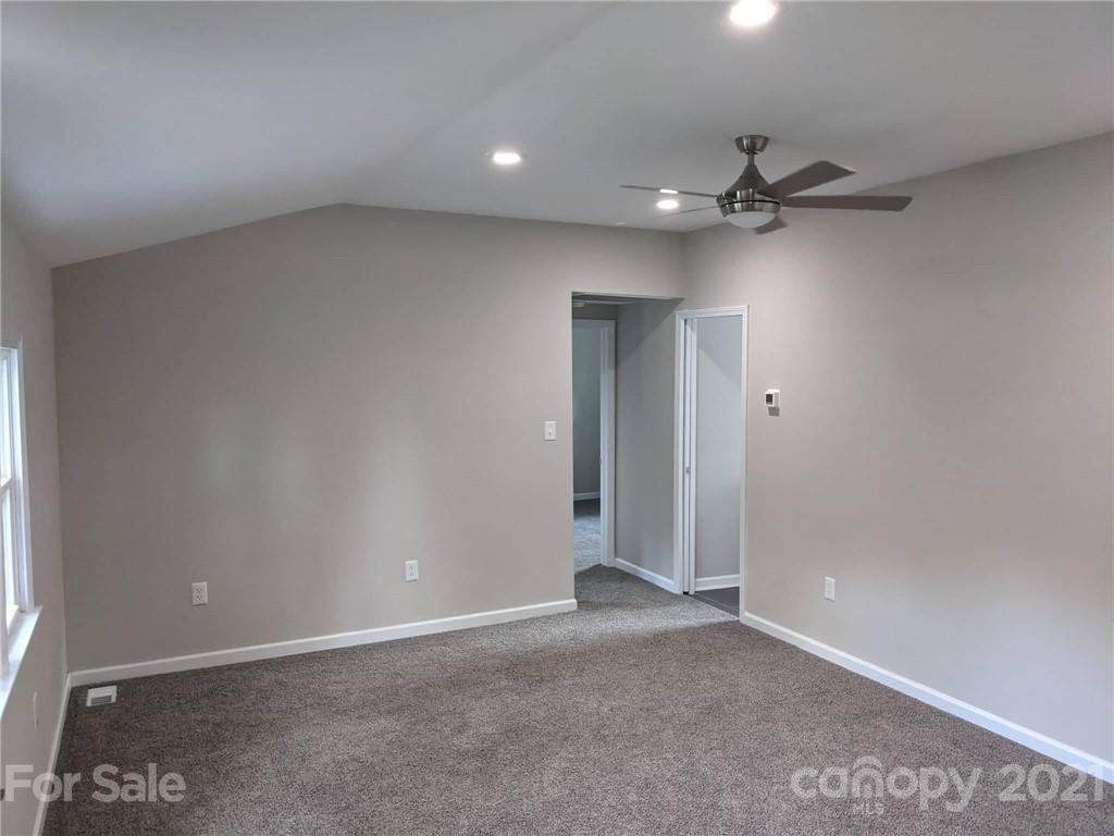 2271 West Chester School Road Chester, SC 29706 - Photo 11 of 19 an empty room with a ceiling fan and a window
