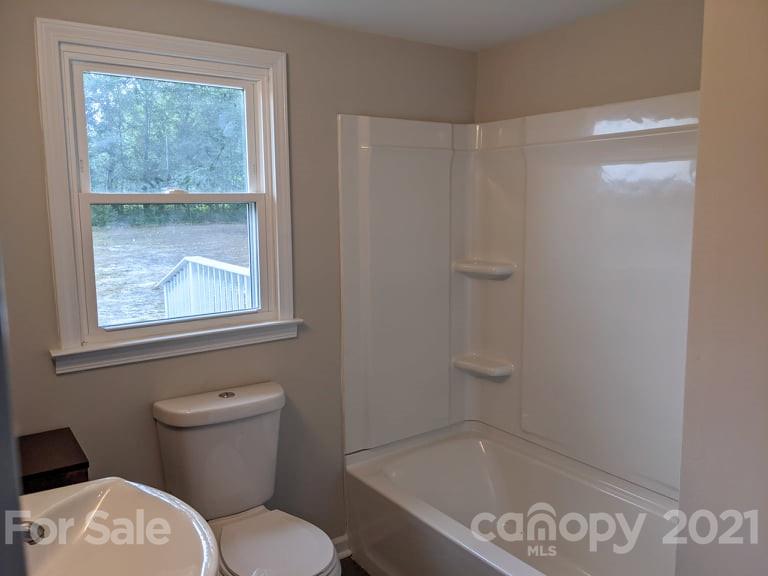 2271 West Chester School Road Chester, SC 29706 - Photo 14 of 19 a bathroom with a toilet and a shower
