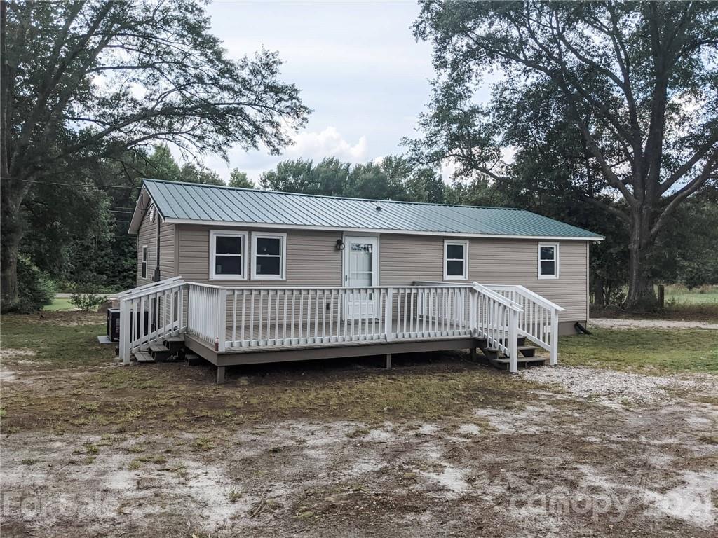 2271 West Chester School Road Chester, SC 29706 - Photo 17 of 19 a view of a house with a yard and deck