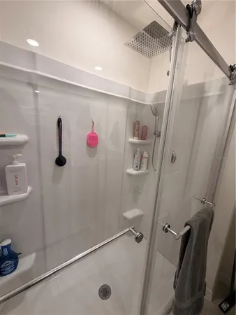 a bathroom with a shower and a tub