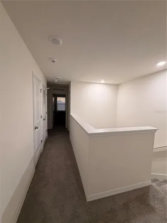 a view of a utility room with cabinets