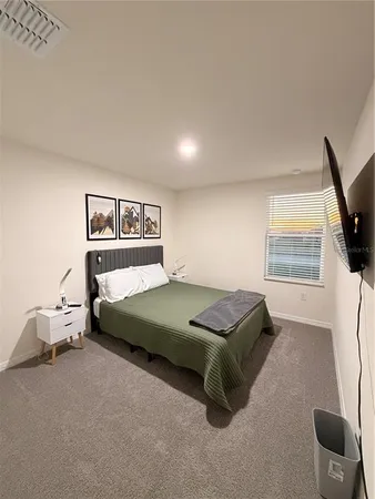 a bathroom with a granite countertop sink toilet and mirror