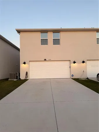 a view of parking and utility room
