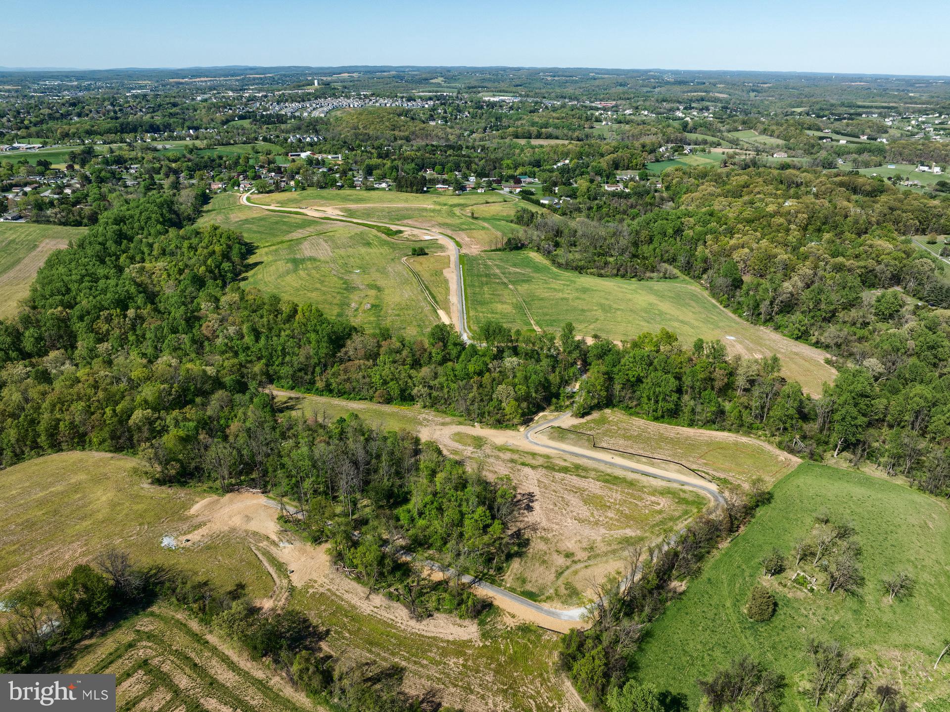 707007728 Hook Road, Unit SAVANNAH Westminster, MD 21157 - Photo 17 of 18 a view of a city with lush green forest