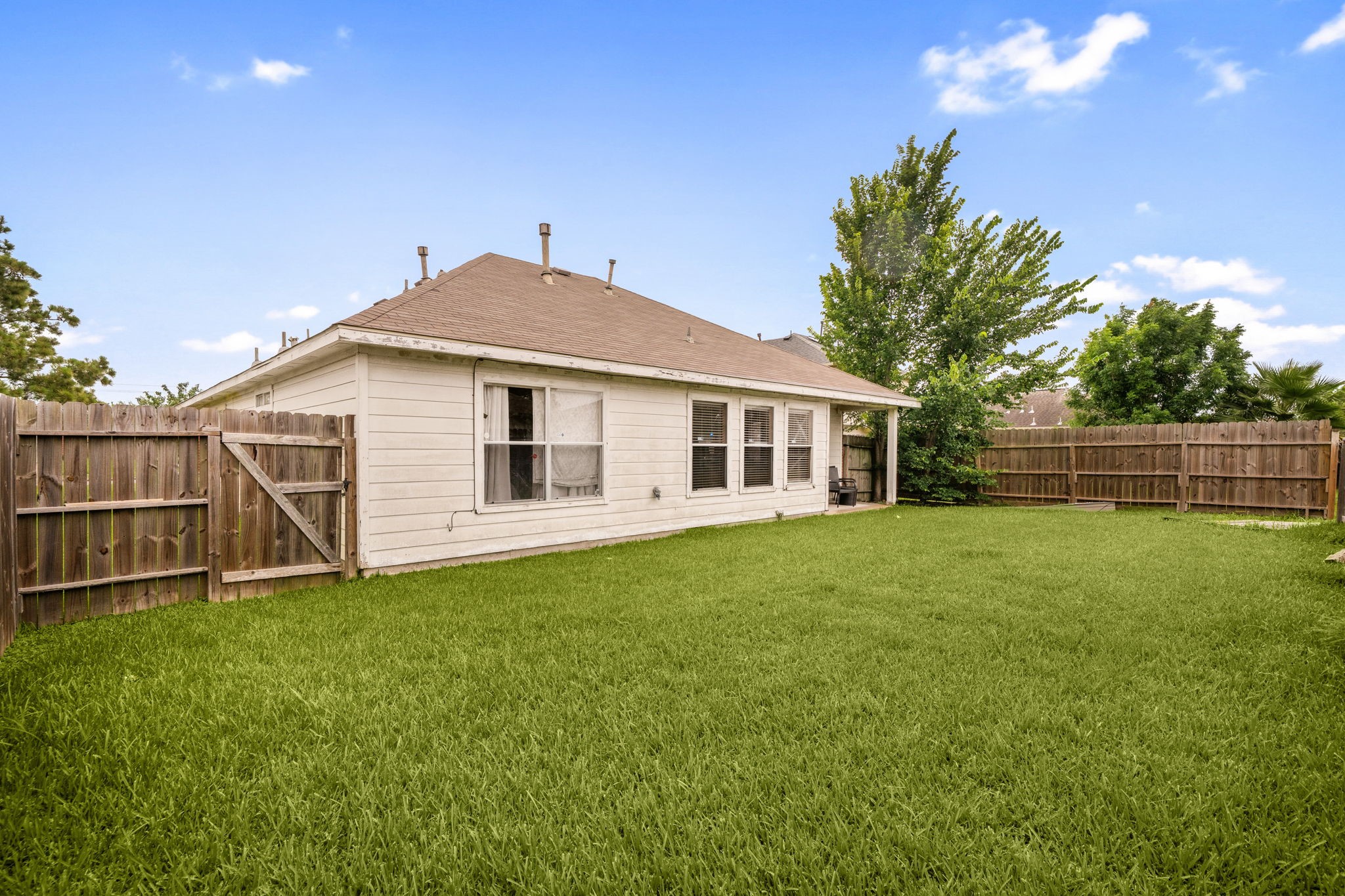16602 Lazy Ridge Road Houston, TX 77053 - Photo 13 of 16 The back yard is spacious and maintainable at the same time.
