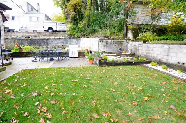 a view of swimming pool with outdoor seating and plants