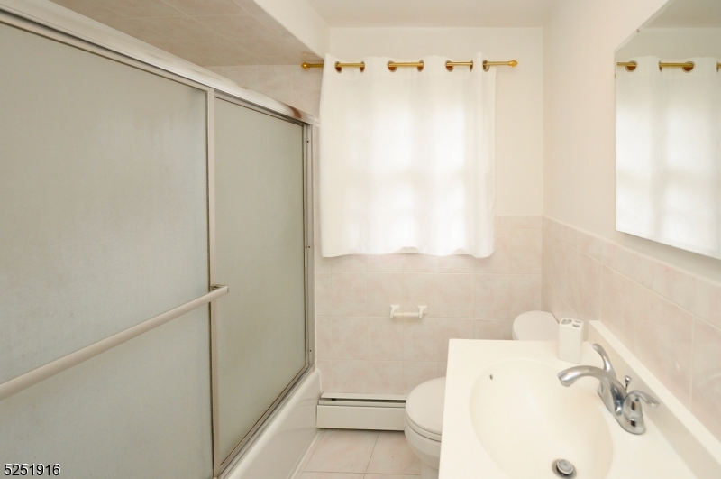 4 Mary Street Hawthorne, NJ 07506 - Photo 10 of 12 a bathroom with a sink and a shower