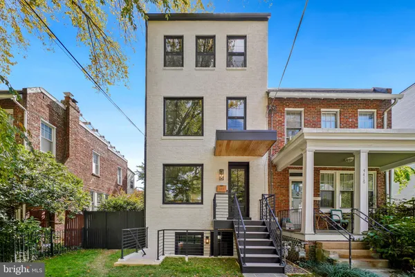 a view of a building with a yard