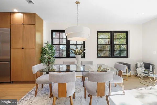 a dining room with furniture and window