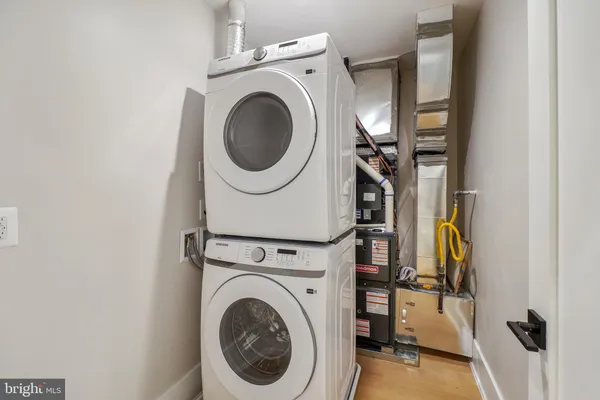 a view of a storage & utility room with dryer and washer