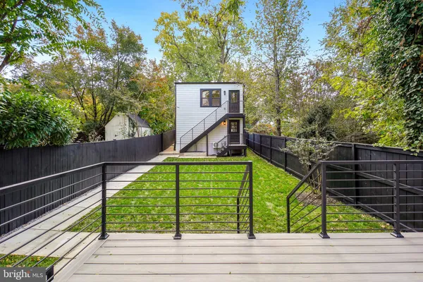 a view of a deck with a small yard