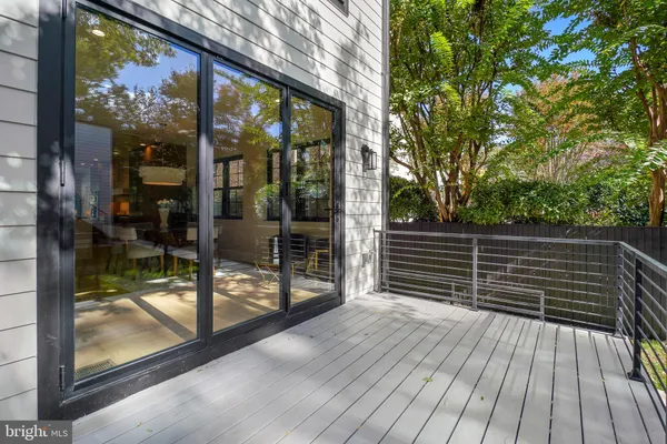 a balcony view with a glass door
