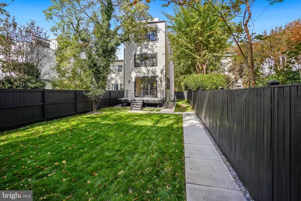 a view of a pathway with a garden