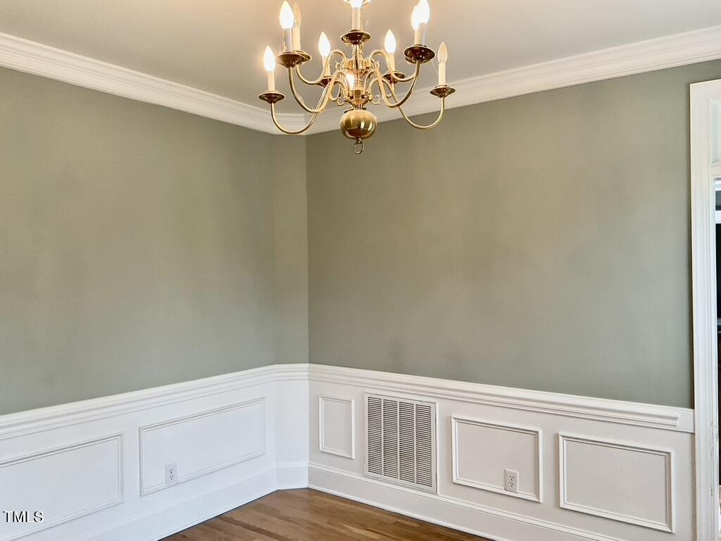 4209 Old Lewis Farm Road Raleigh, NC 27604 - Photo 11 of 47 a view of a room with rack on the wall