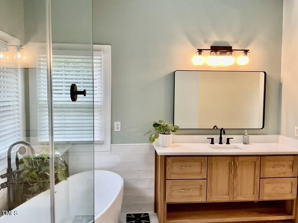 4209 Old Lewis Farm Road Raleigh, NC 27604 - Photo 16 of 47 a bathroom with a sink and a mirror