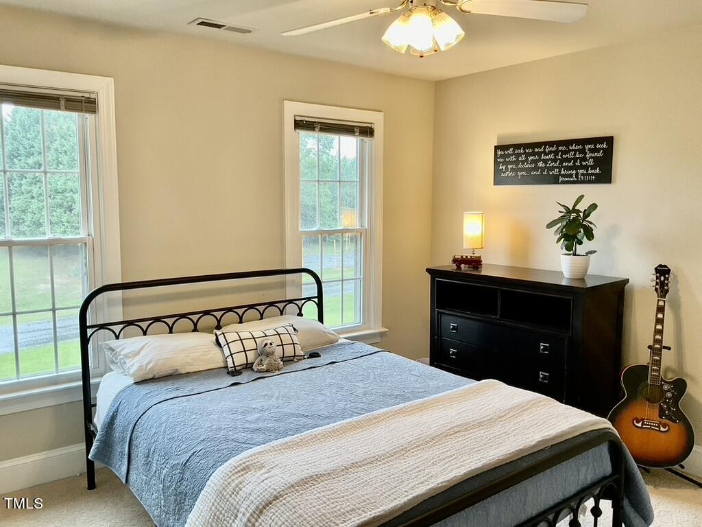 4209 Old Lewis Farm Road Raleigh, NC 27604 - Photo 19 of 47 a bedroom with a bed and a dresser