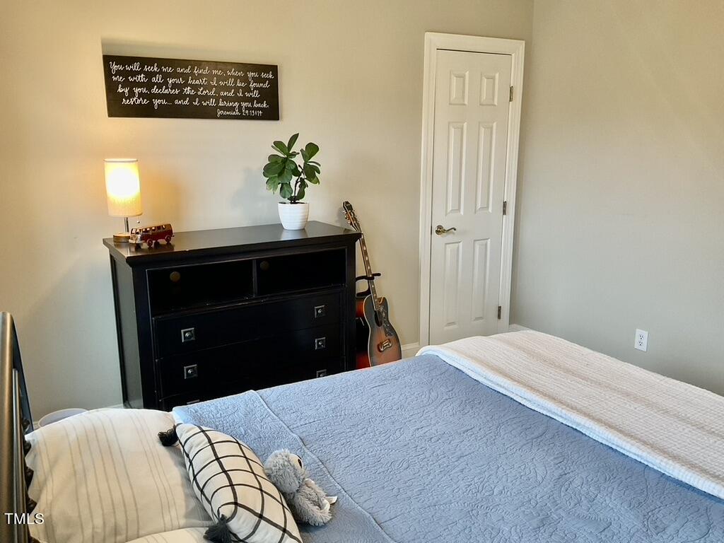 4209 Old Lewis Farm Road Raleigh, NC 27604 - Photo 20 of 47 a bedroom with a bed and a dresser