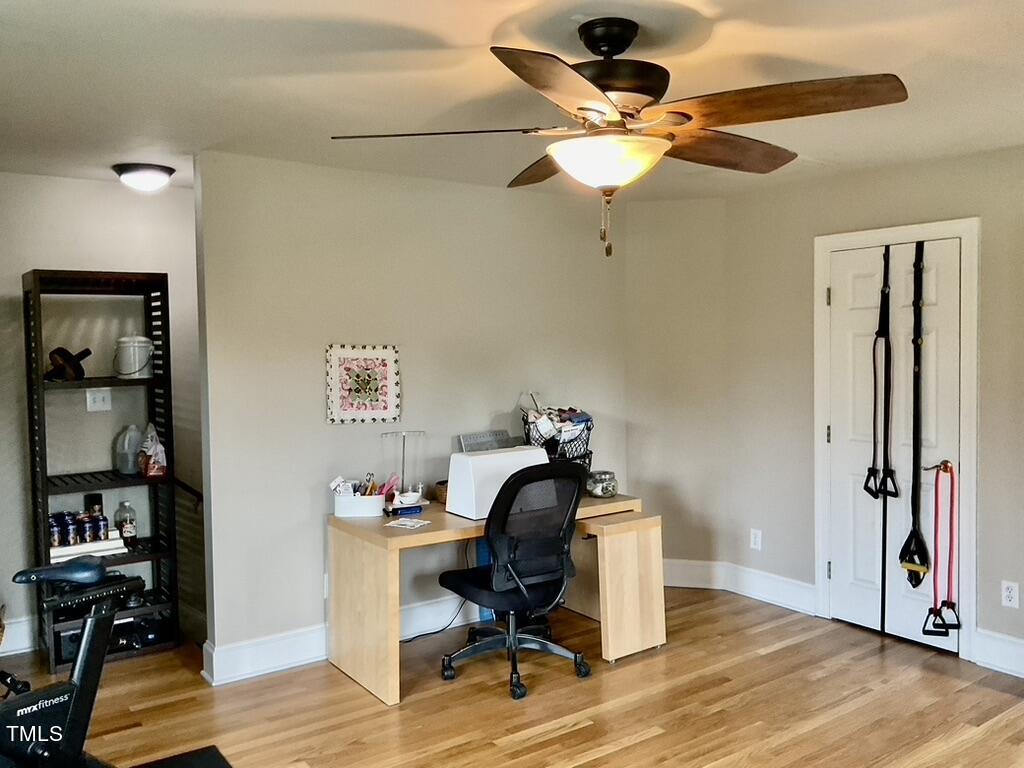 4209 Old Lewis Farm Road Raleigh, NC 27604 - Photo 23 of 47 a workspace with furniture and wooden floor