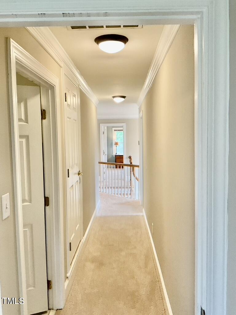 4209 Old Lewis Farm Road Raleigh, NC 27604 - Photo 25 of 47 a view of a hallway with wooden floor and furniture in a room