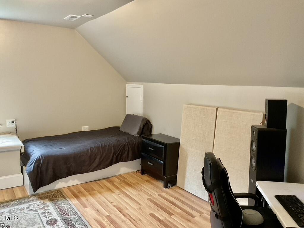 4209 Old Lewis Farm Road Raleigh, NC 27604 - Photo 27 of 47 a bedroom with a bed window and a chair