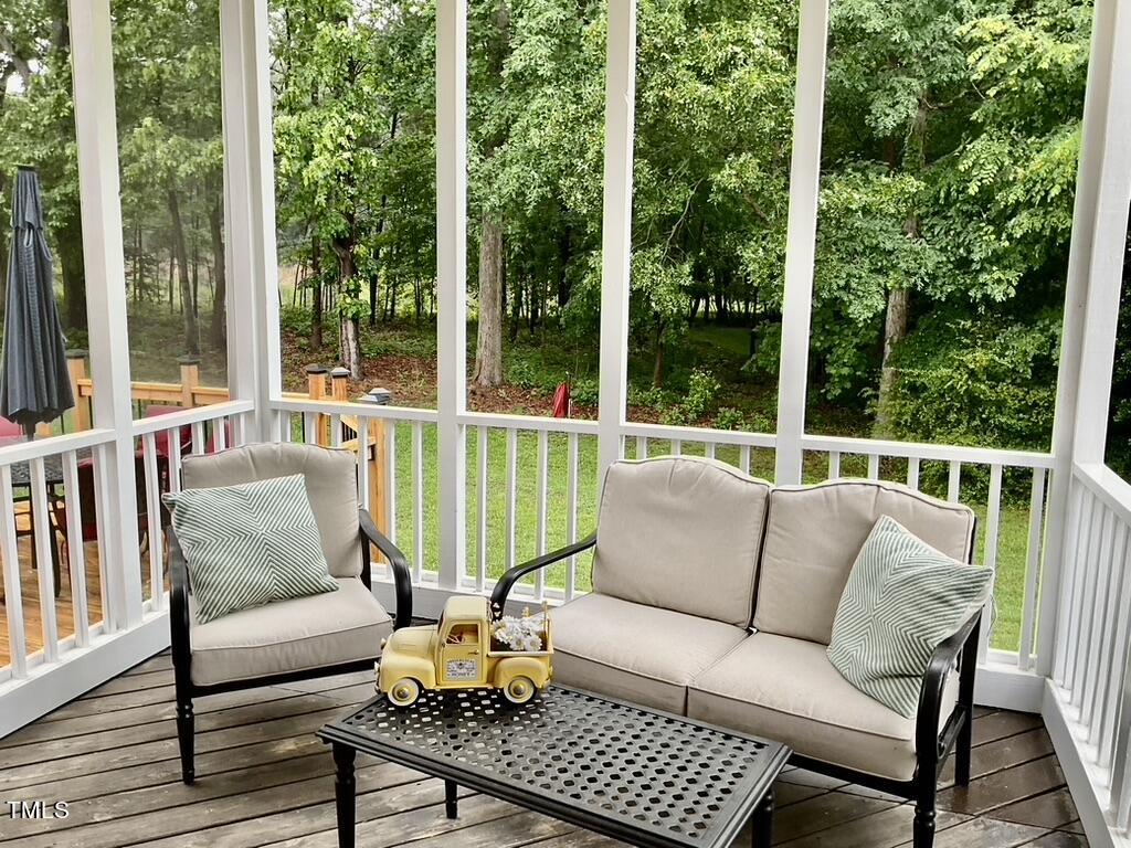 4209 Old Lewis Farm Road Raleigh, NC 27604 - Photo 31 of 47 a balcony with furniture and a garden