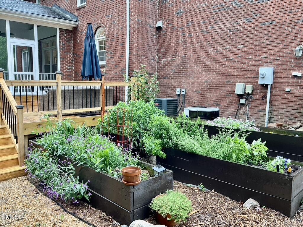 4209 Old Lewis Farm Road Raleigh, NC 27604 - Photo 33 of 47 front view of a house with a garden