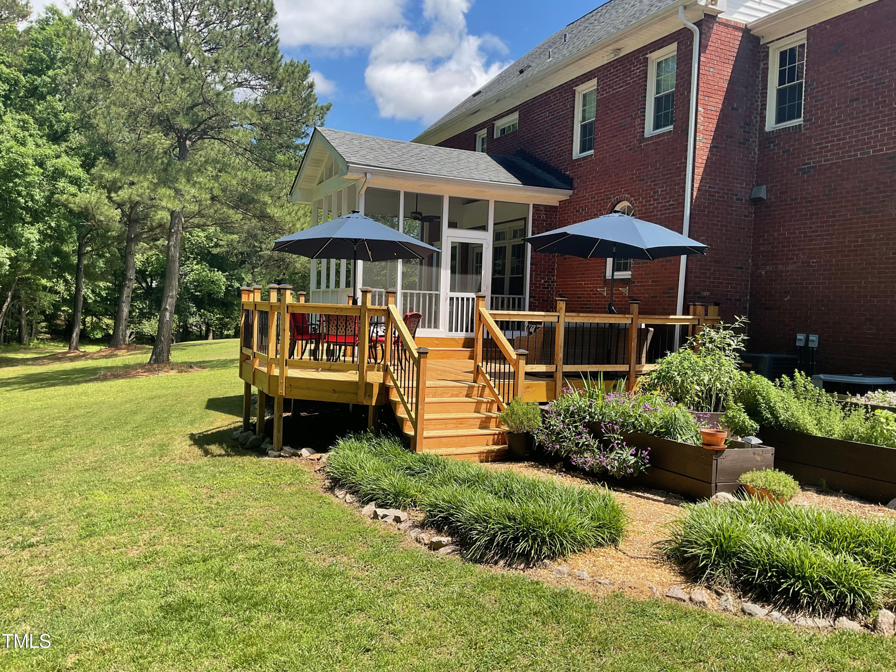 4209 Old Lewis Farm Road Raleigh, NC 27604 - Photo 36 of 47 a front view of a house with a garden