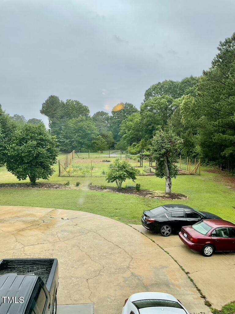 4209 Old Lewis Farm Road Raleigh, NC 27604 - Photo 44 of 47 a car parked on the side of the lake