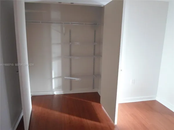 a kitchen with stainless steel appliances granite countertop a refrigerator and a stove