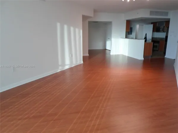 a kitchen with stainless steel appliances granite countertop a refrigerator and a stove
