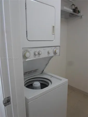 a view of a kitchen with wooden floor and a kitchen