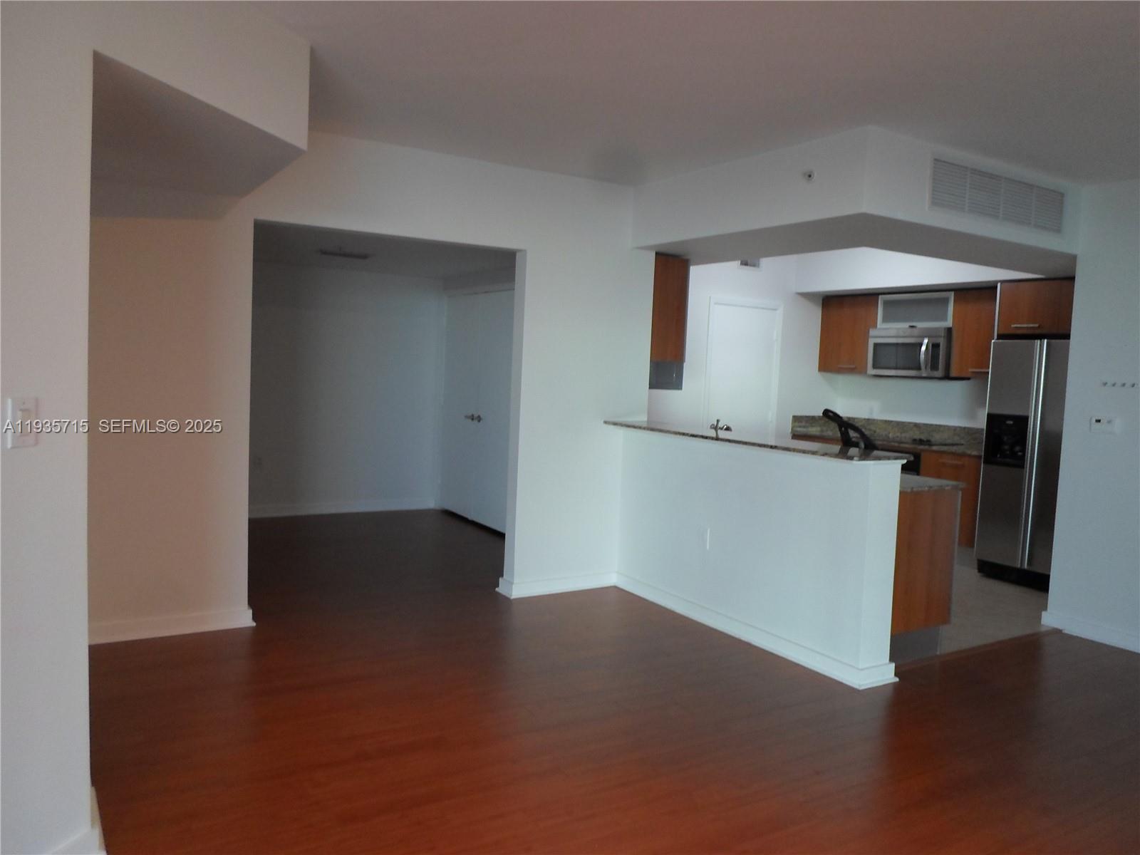 9066 Southwest 73rd Court, Unit 1910 Miami, FL 33156 - Photo 39 of 43 Kitchen and den