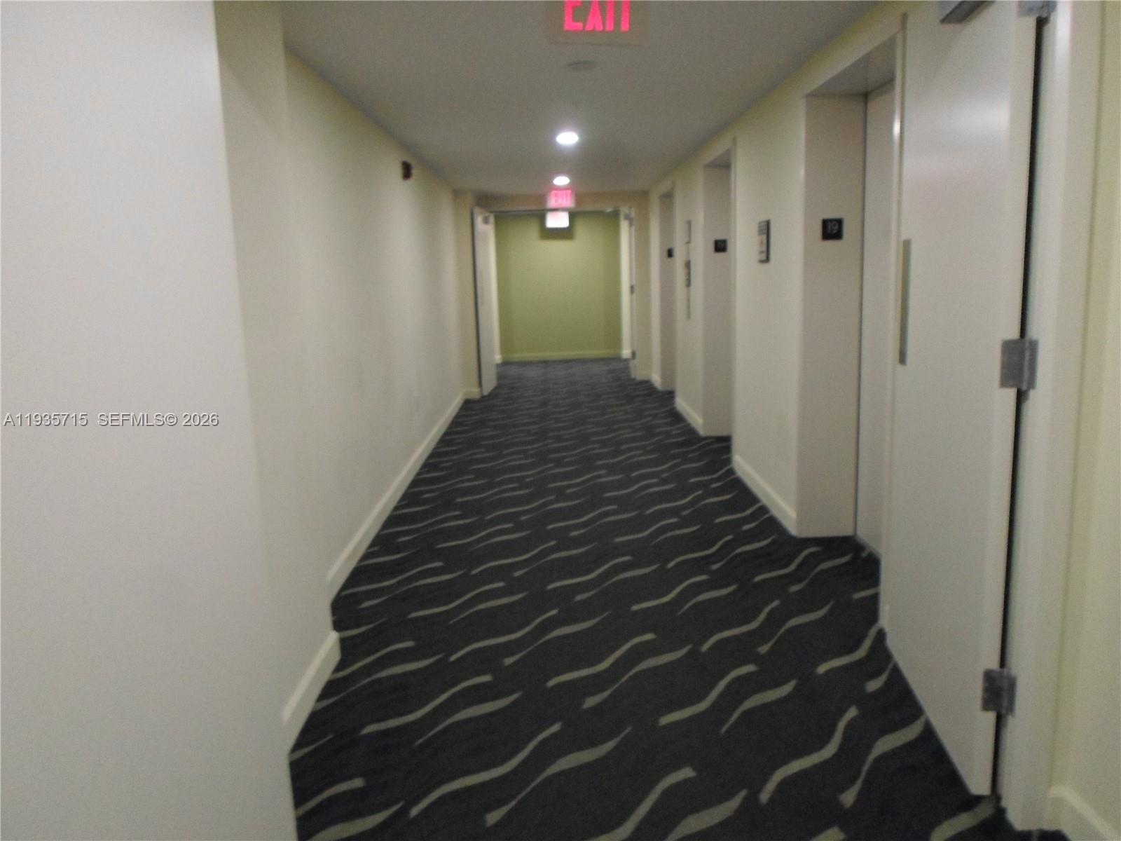 9066 Southwest 73rd Court, Unit 1910 Miami, FL 33156 - Photo 42 of 43 Building hallway