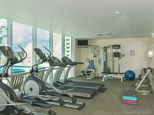 a kitchen with a sink and a refrigerator